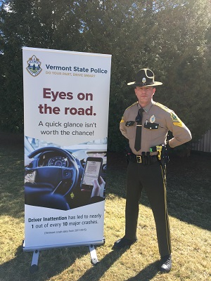 Trooper with distracted driver sign