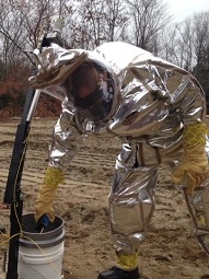 Team member in protective suit